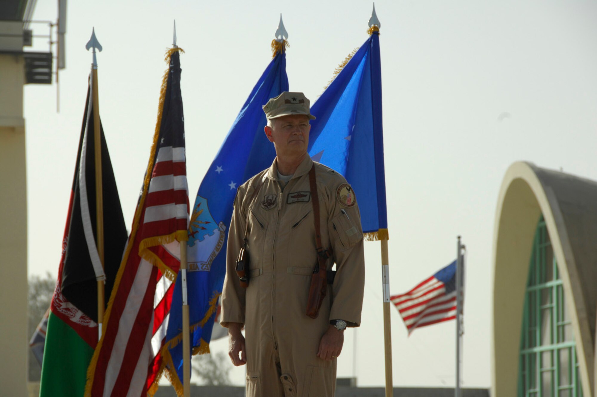 KANDAHAR AIRFIELD, Afghanistan - Brigadier General Guy M. Walsh stands ready to give his first remarks as the new Wing commander for the 451st Air Expeditionary Wing here after an assumption of command and activation ceremony July 2, 2009.  The 451st transitioned from a group to a wing at 7 a.m. as Lt. General Gary L. North, 9th Air Force and Air Forces Central commander, handed Gen. Walsh the guidon.  General Walsh was the wing commander for the 175th Wing, Maryland Air National Guard, Baltimore, Maryland, before accepting his assignment here.  (U.S. Air Force photo by 1st Lt. Noelle Caldwell)