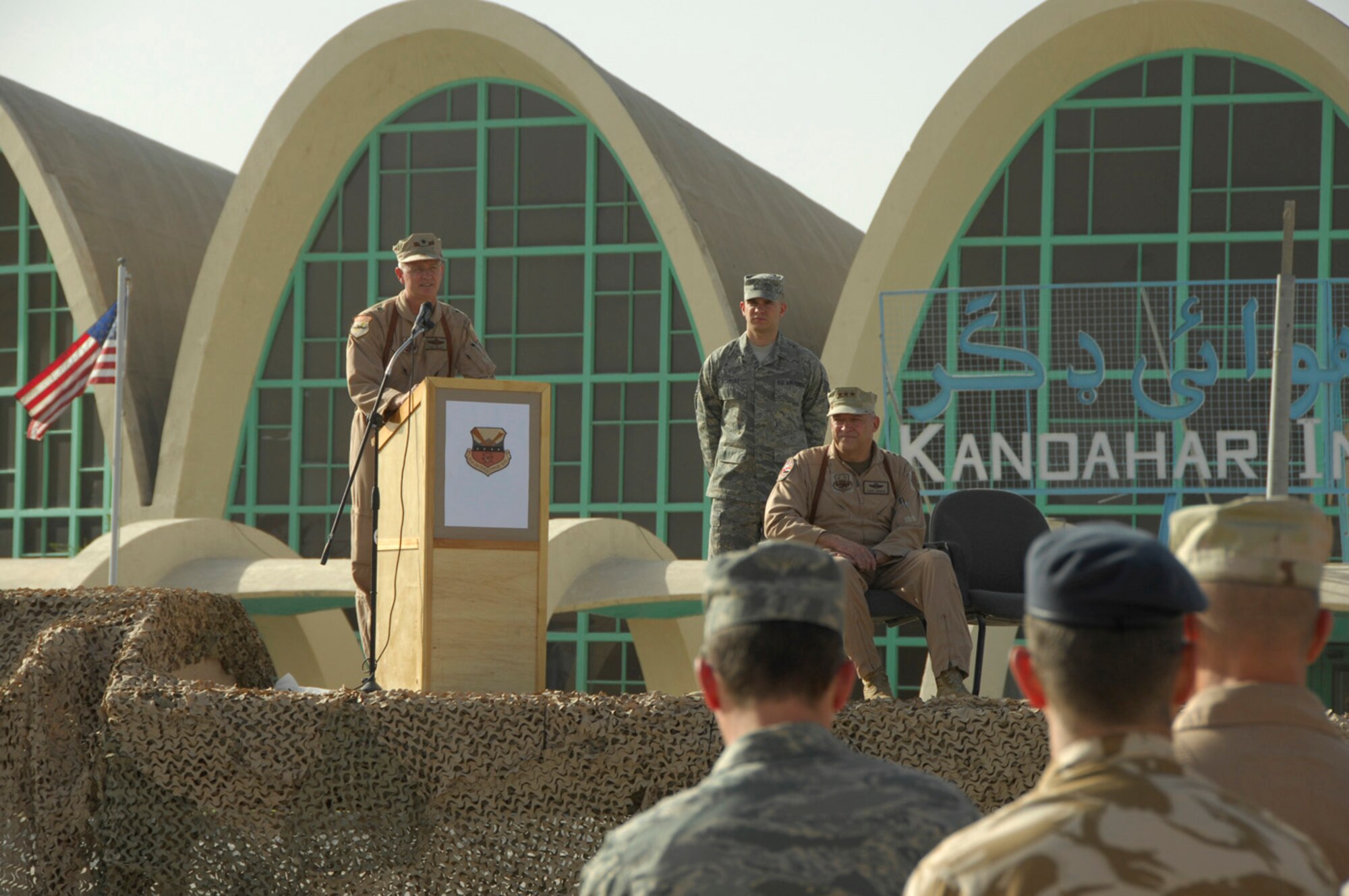 ANDAHAR AIRFIELD, Afghanistan - Brig. Gen. Guy M. Walsh addresses 451st Airmen, distinguished visitors and coalition partners as the new Wing commander for the 451st Air Expeditionary Wing here after an assumption of command and activation ceremony July 2, 2009.  The 451st transitioned from a group to a wing at 7 a.m. as Lt. Gen. Gary L. North, 9th Air Force and U.S. Air Forces Central commander, handed Gen. Walsh the guidon.  General Walsh was the wing commander for the 175th Wing, Maryland Air National Guard before accepting his assignment here.  (U.S. Air Force photo by 1st Lt. Noelle Caldwell)