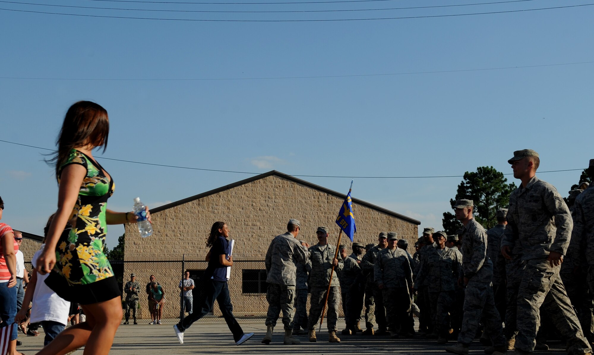 MOODY AIR FORCE BASE, Ga. -- Family and friends run to greet returning members of the 824th Security Forces Squadron here July 3. The 824th SFS just returned from a six-month deployment to Iraq. (U.S. Air Force photo by Senior Airman Gina Chiaverotti)