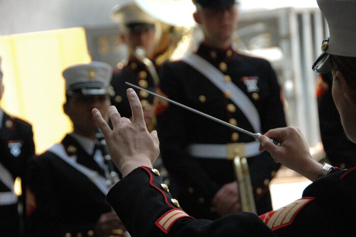 Staff Sgt. Kristine Streng, Albany Ga., Marine Corps Band, enlisted conductor, warms up the band before playing the Canadian and American National Anthem before the New York Yankees vs Toronto Blue Jays baseball game at Yankee Stadium, New York City, July 4. The band plays for more than 250,000 people each year while touring the country. (Official Marine Corps photo by Sgt. Randall A. Clinton)
