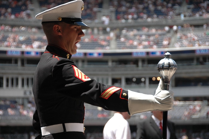 Staff Sgt. Ignatius J. Keogh, Albany Ga., Marine Corps Band, drum major, calls to his Marines before marching them the field at Yankee Stadium, N.Y., His Marines played the Canadian and American National Anthem before the New York Yankees vs Toronto Blue Jays baseball game at Yankee Stadium, New York City, July 4. The band plays for more than 250,000 people each year while touring the country. (Official Marine Corps photo by Sgt. Randall A. Clinton)