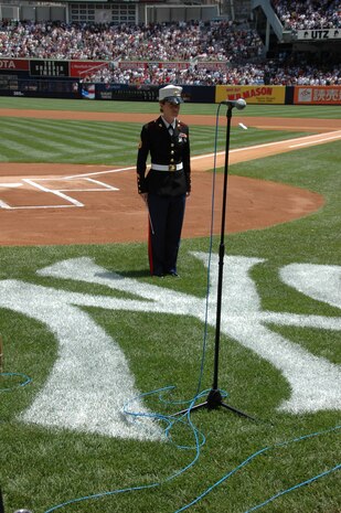 Staff Sgt. Kristine Streng, Albany Ga., Marine Corps Band, enlisted conductor, waits to begin the National Anthem before the New York Yankees vs Toronto Blue Jays baseball game at Yankee Stadium, New York City, July 4. The band plays for more than 250,000 people each year while touring the country. (Official Marine Corps photo by Sgt. Randall A. Clinton)