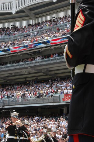 Staff Sgt. Kristine Streng, Albany Ga., Marine Corps Band, enlisted conductor, leads her Marines playing the National Anthem before the New York Yankees vs Toronto Blue Jays baseball game at Yankee Stadium, New York City, July 4. The band plays for more than 250,000 people each year while touring the country. (Official Marine Corps photo by Sgt. Randall A. Clinton)