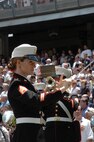 Staff Sgt. Kristine Streng, Albany Ga., Marine Corps Band, enlisted conductor, leads the band playing the National Anthem before the New York Yankees vs Toronto Blue Jays baseball game at Yankee Stadium, New York City, July 4. The band plays for more than 250,000 people each year while touring the country. (Official Marine Corps photo by Sgt. Randall A. Clinton)