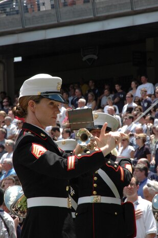 Staff Sgt. Kristine Streng, Albany Ga., Marine Corps Band, enlisted conductor, leads the band playing the National Anthem before the New York Yankees vs Toronto Blue Jays baseball game at Yankee Stadium, New York City, July 4. The band plays for more than 250,000 people each year while touring the country. (Official Marine Corps photo by Sgt. Randall A. Clinton)