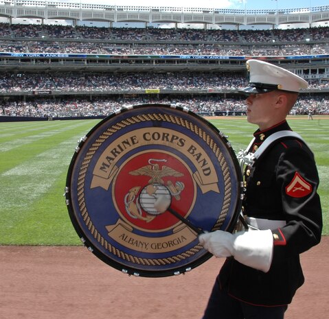 Lance Cpl. Geoffrey Parks, Albany Ga., Marine Corps Band, drummer, marches off the field after playing the National Anthem before the New York Yankees vs Toronto Blue Jays baseball game at Yankee Stadium, New York City, July 4. The band plays for more than 250,000 people each year while touring the country. (Official Marine Corps photo by Sgt. Randall A. Clinton)