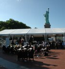 The Albany Marine Corps Band plays during the reopening ceremony for the Statue of Liberty crown, July 4. The top of the statue had been closed since the terrorist attacks of 9/11. The band plays for more than 250,000 people each year while touring the country. (Official Marine Corps photo by Sgt. Randall A. Clinton)