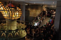 Press photographers and visitors attempt to capture the ribbon cutting at the base of the Statue of Liberty, July 4. The cutting ceremony officially reopened the crown for visitors after the terrorist attacks of 9/11. (Official Marine Corps photo by Sgt. Randall A. Clinton)