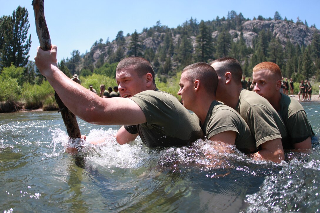 Naval Reserve Officer Training Corps midshipmen wade through icy waters at Mountain Warfare Training Center Bridgeport, Calif., July 5 when they learned to cross streams in mountainous terrain
