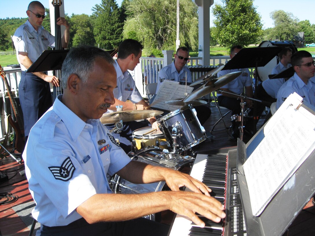 July 5, 2009:  The Air National Guard Band "Ambassadors" perform at Hamilton-Wenham's Family Independence Day Celebration at Patton Park. Ms Joanne Patton, wife of the late General George S. Patton IV, met the band senior leadership prior to the performance.  Here, SSgt Raul Santiago is playing a solo with the rhythm section. 