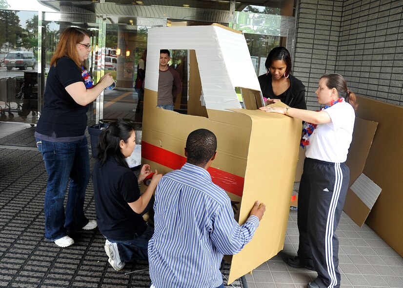 MISAWA AIR BASE, Japan -- Team FSS builds their vehicle for the "Nascart" competition July 4, at the Tohoku enlisted club. Team FSS won the most decorative category of the competition. (Air Force photo/Senior Airman Chad C. Strohmeyer)  

