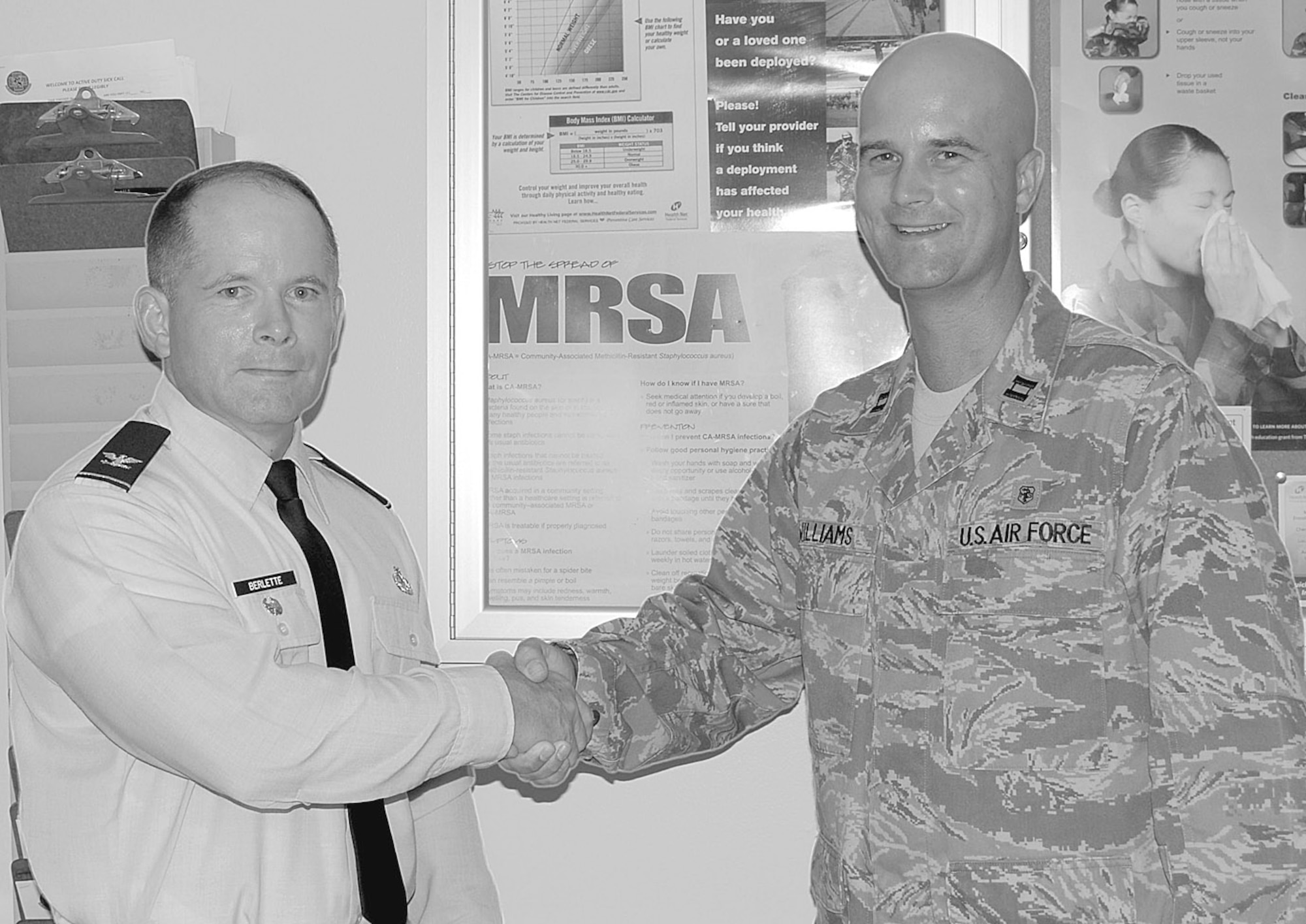 Col. Craig Berlette, 43rd Airlift Wing Vice Commander, recognizes Capt. Stephen Williams, 43rd Aerospace Medicine Squadron, on behalf of Col. James Johnson, 43rd Airlift Wing Commander. Captain Williams raised $3,500 to support activities on Pope through the Difference Maker's golf tournament. (U.S. Photo by 2nd Lt. Cammie Quinn)