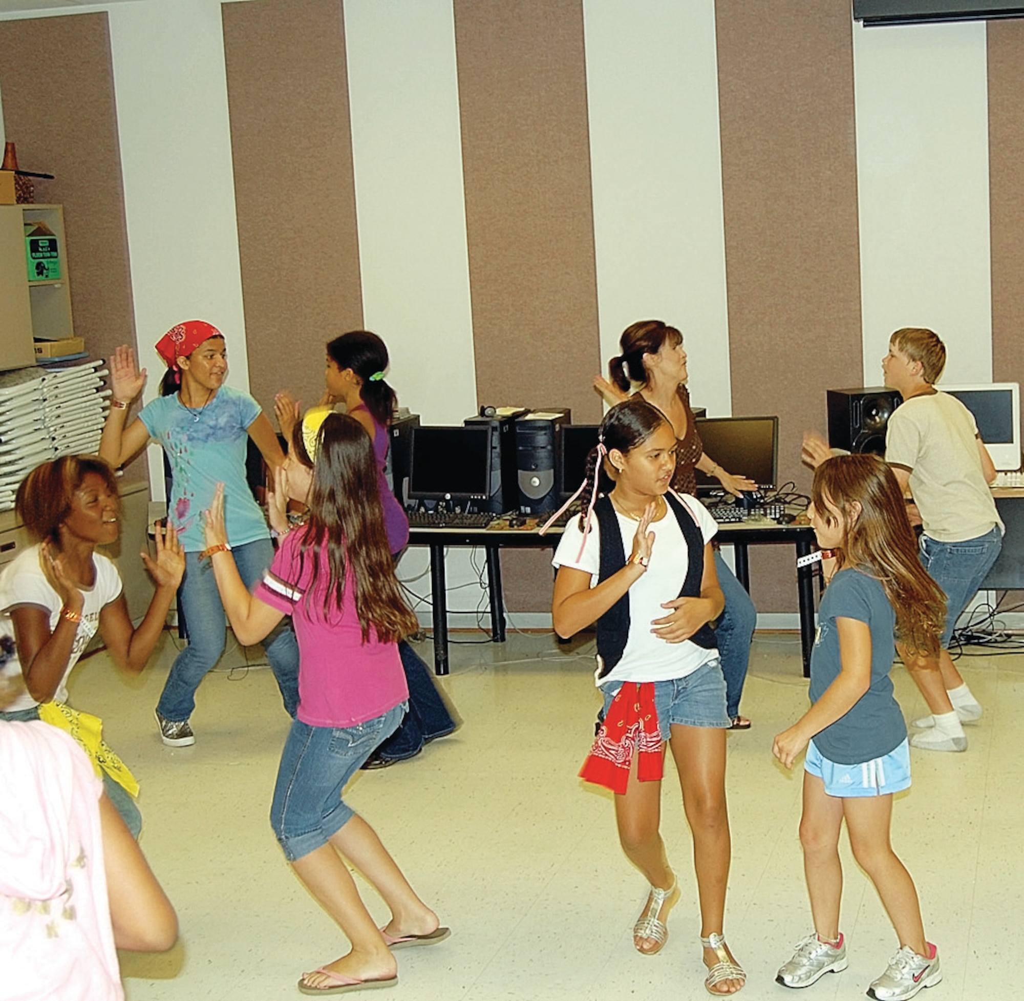 The fifth and sixth grade Good Fruit Dancers danced June 27 at the Vacation BIble School held at the Pope Chapel June 23- 27. This year's Vacation Bible School hosted 146 students and over 40 volunteers and the theme, "Son Harvest," focused on practicing peace, patience and perseverance. (U.S. Air Force Photo by 2nd Lt. Cammie Quinn)