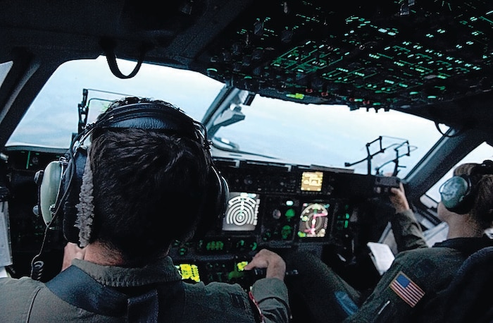 Capts. Jon Dark and Kristen Franke, 437th Airlift Wing, fly a C-17 during the June 24 Joint Forcible Entry Exercise mission. JFEX is a week-long exercise designed to enhance cohesiveness between the Air Force and Army by executing large-scale heavy equipment and troop movements. (U.S. Air Force Photo by 1st Lt. Chris Hoyler)