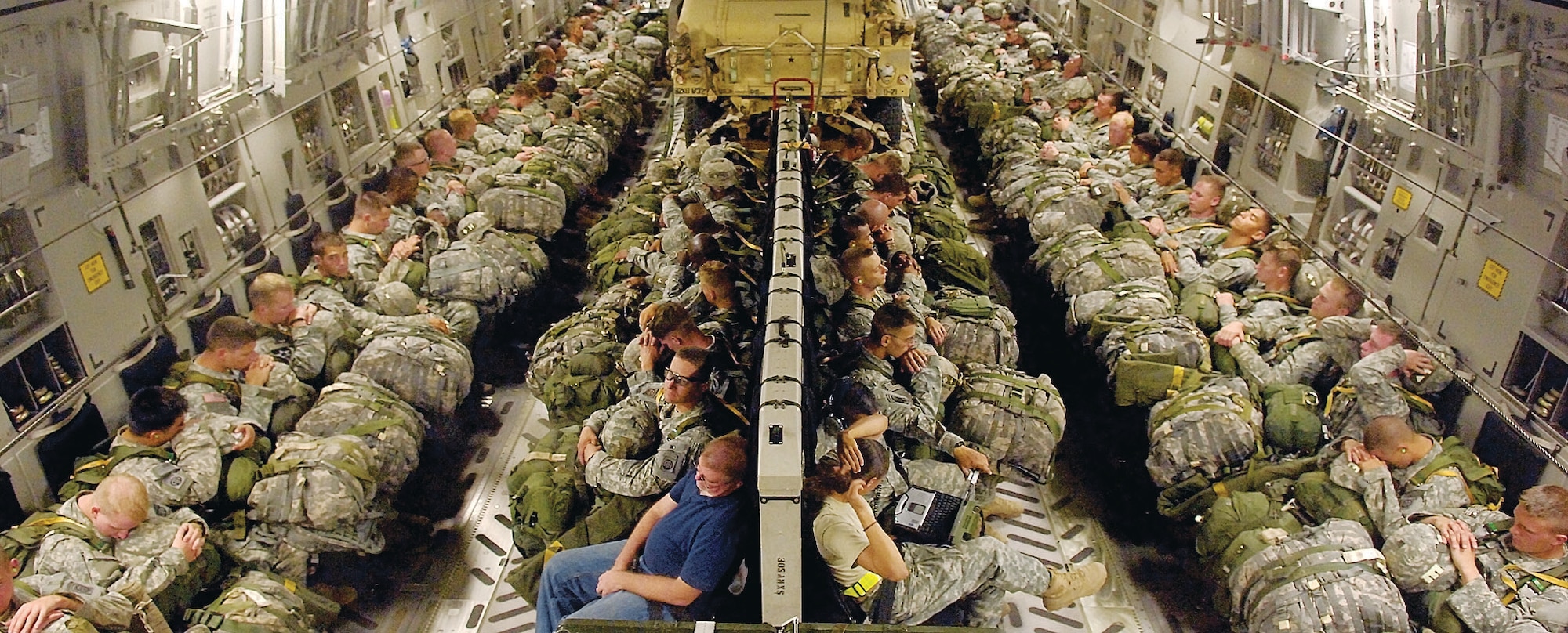 Paratroopers from the 82nd Airborne Division prepare to jump from a C-17, June 24 during Joint Forcible Entry Exercise. Along with the paratroopers, two HMMWVs were dropped from the aircraft prior to the paratroopers’ jump. (U.S. Air Force Photo by 1st Lt. Chris Hoyler)