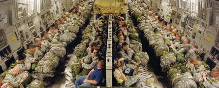 Paratroopers from the 82nd Airborne Division prepare to jump from a C-17, June 24 during Joint Forcible Entry Exercise. Along with the paratroopers, two HMMWVs were dropped from the aircraft prior to the paratroopers’ jump. (U.S. Air Force Photo by 1st Lt. Chris Hoyler)