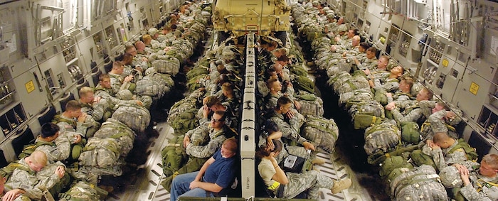 Paratroopers from the 82nd Airborne Division prepare to jump from a C-17, June 24 during Joint Forcible Entry Exercise. Along with the paratroopers, two HMMWVs were dropped from the aircraft prior to the paratroopers’ jump. (U.S. Air Force Photo by 1st Lt. Chris Hoyler)