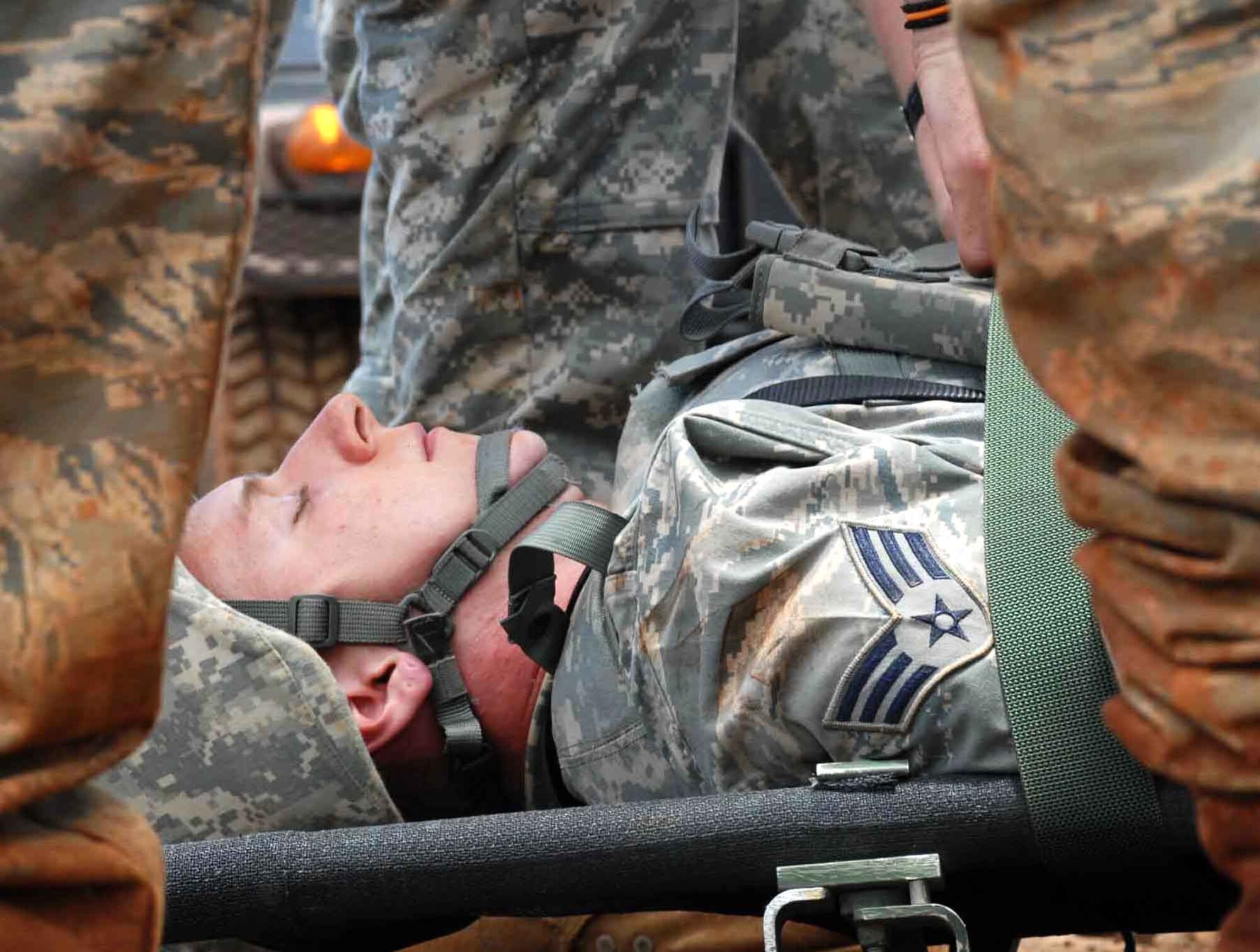 Airman 1st Class Doug Fraites, 25th Air Support Operations Squadron ground radio maintenance, prepares to be medically evacuated from an austere environment during a field training exercise June 24. Tactical air control party members camped at Wheeler Army Airfield's East Range near Hickam Air Force Base, Hawaii, to sharpen proficiencies necessary for upgrade training to become combat mission-ready joint terminal attack controllers. Training like this ensures safe and reliable wartime readiness for TACPs. (U.S. Air Force photo/Senior Airman Carolyn Viss) 

