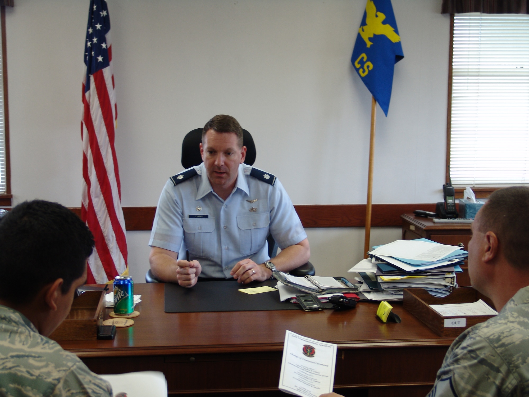 Lt. Col. Rob Lyman, 96th Communications Squadron commander, goes over details for his change of command.  The colonel was recently selected at a White House Fellow. (USAF photo/Lois Walsh)