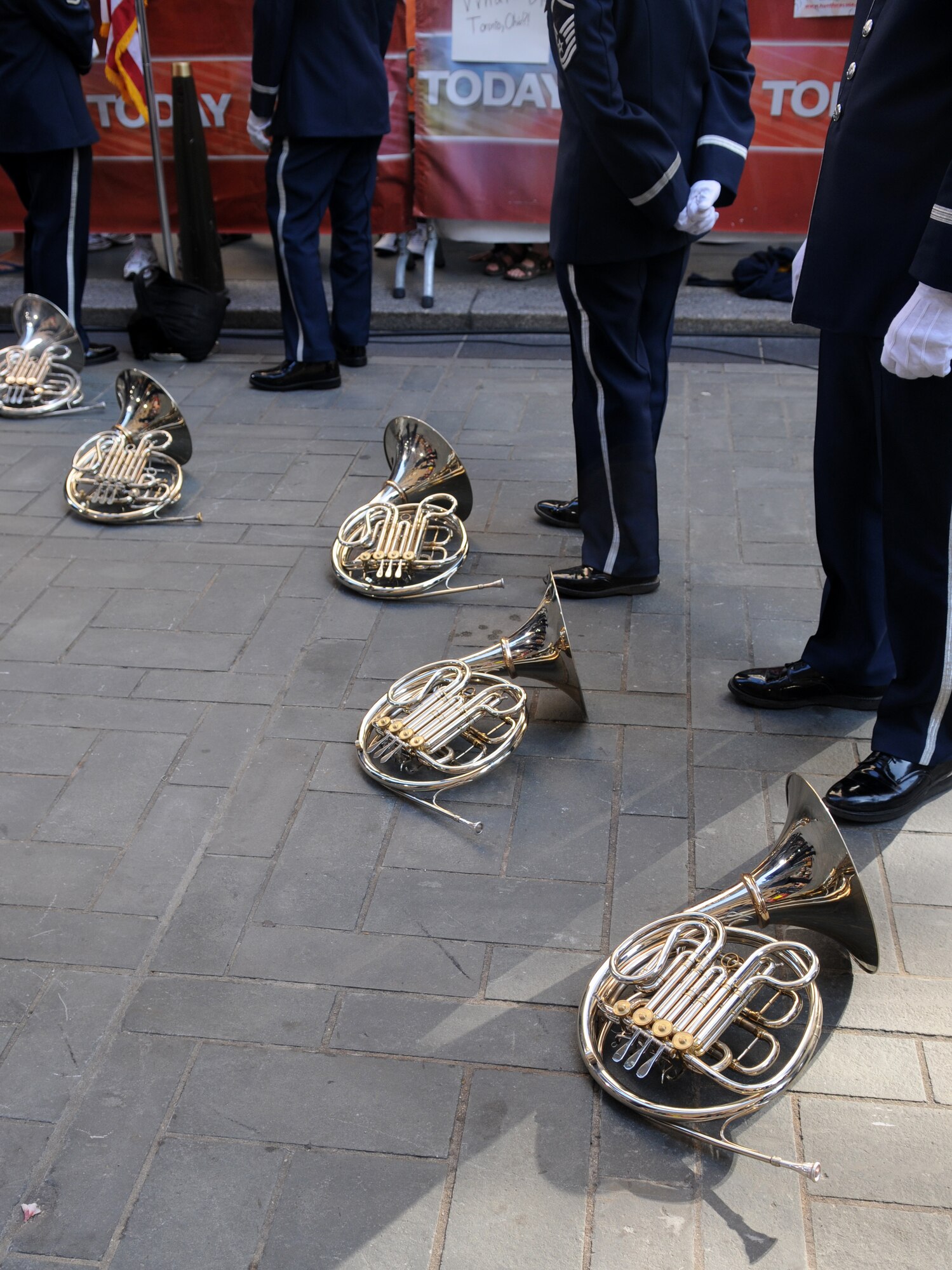 Members of the Ceremonial Brass rest in between takes of the live Independence Day broadcast from Rockefeller Plaza in New York City. The Ceremonial Brass performed patriotic music and marches throughout the telecast, before and after commercial breaks. (U.S. Air Force photo by Senior Airman Marleah Miller)