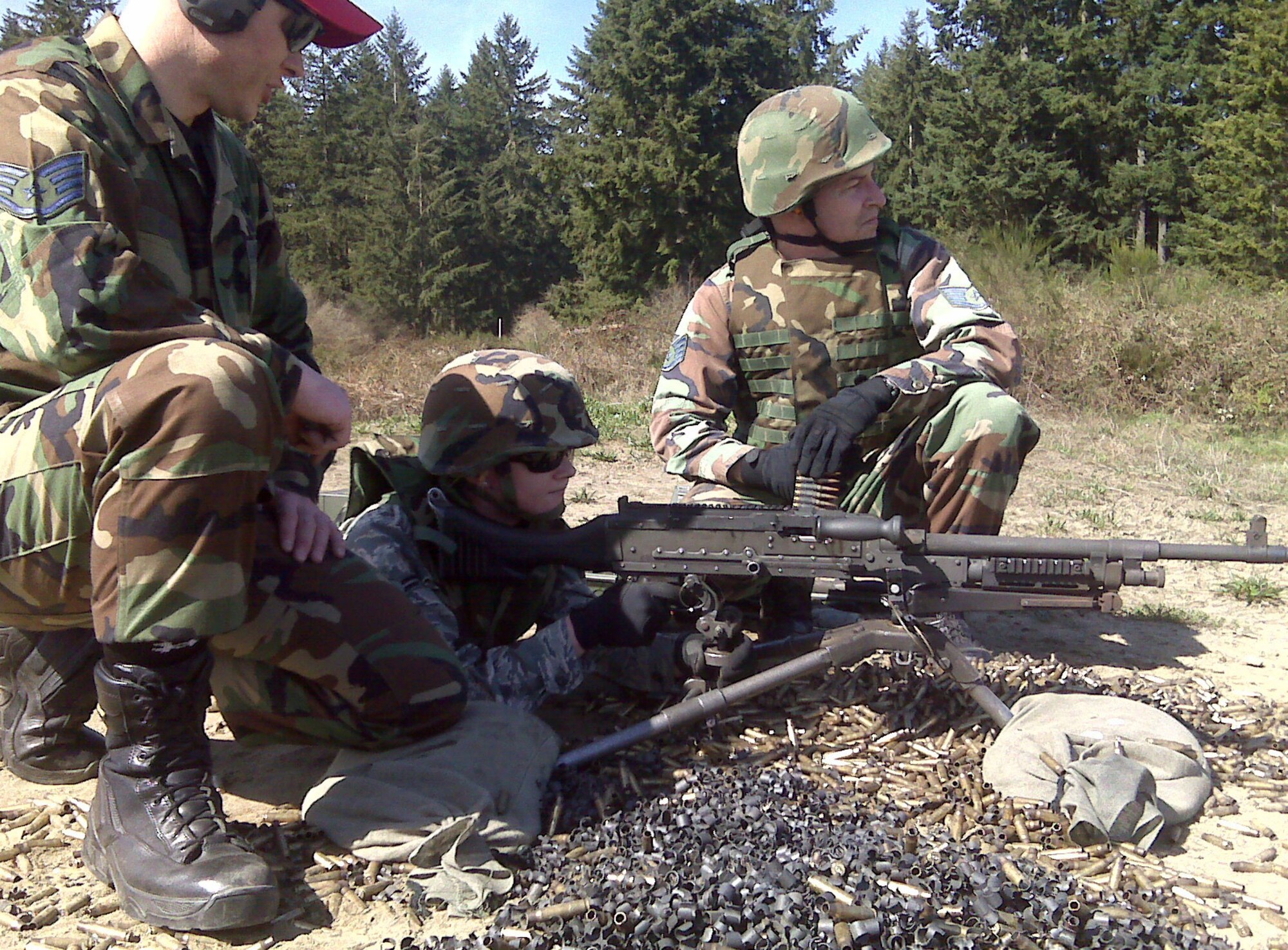 446th Security Forces Squadron members practice on the gun range in preparation for the squadron's deployment to Kirkuk, Iraq, July 5. The squadron sent a flight of 22 personel.