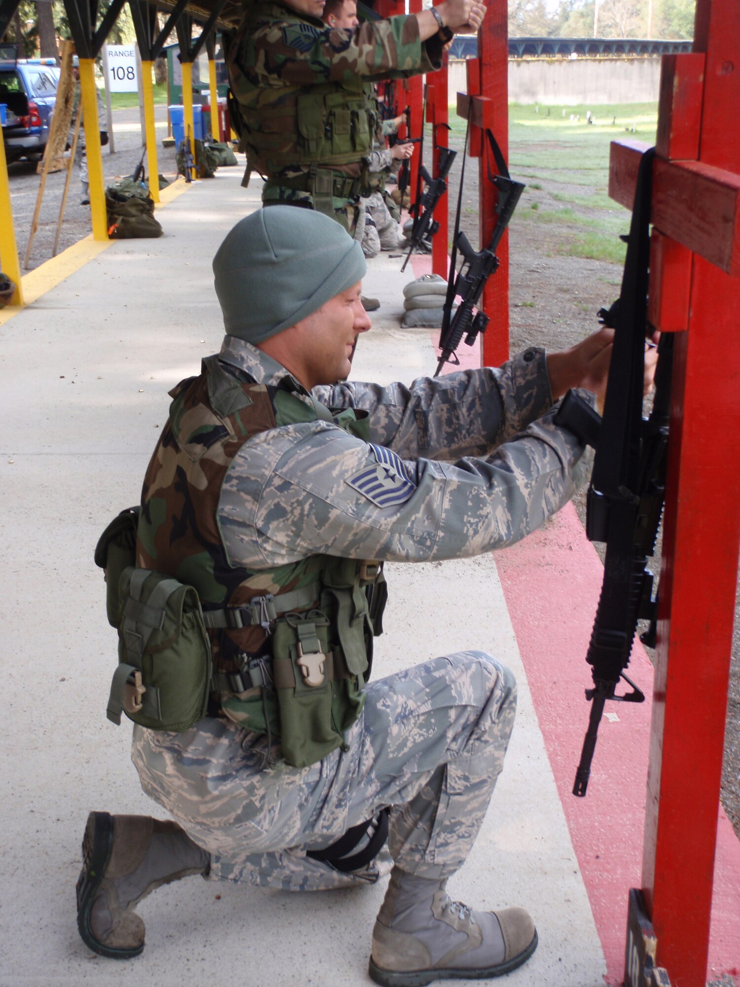 Tech. Sgt. Jason Steen, the 446th Security Forces Squadron unit deployment manager, practices on the 9 mm pistol range in preparation for the squadron's deployment to Kirkuk, Iraq, July 5. The squadron is sending a flight of 22 personel. This will be the first time since Sept. 11 that the squadron has participated in an Air Expeditionary Force deployment.