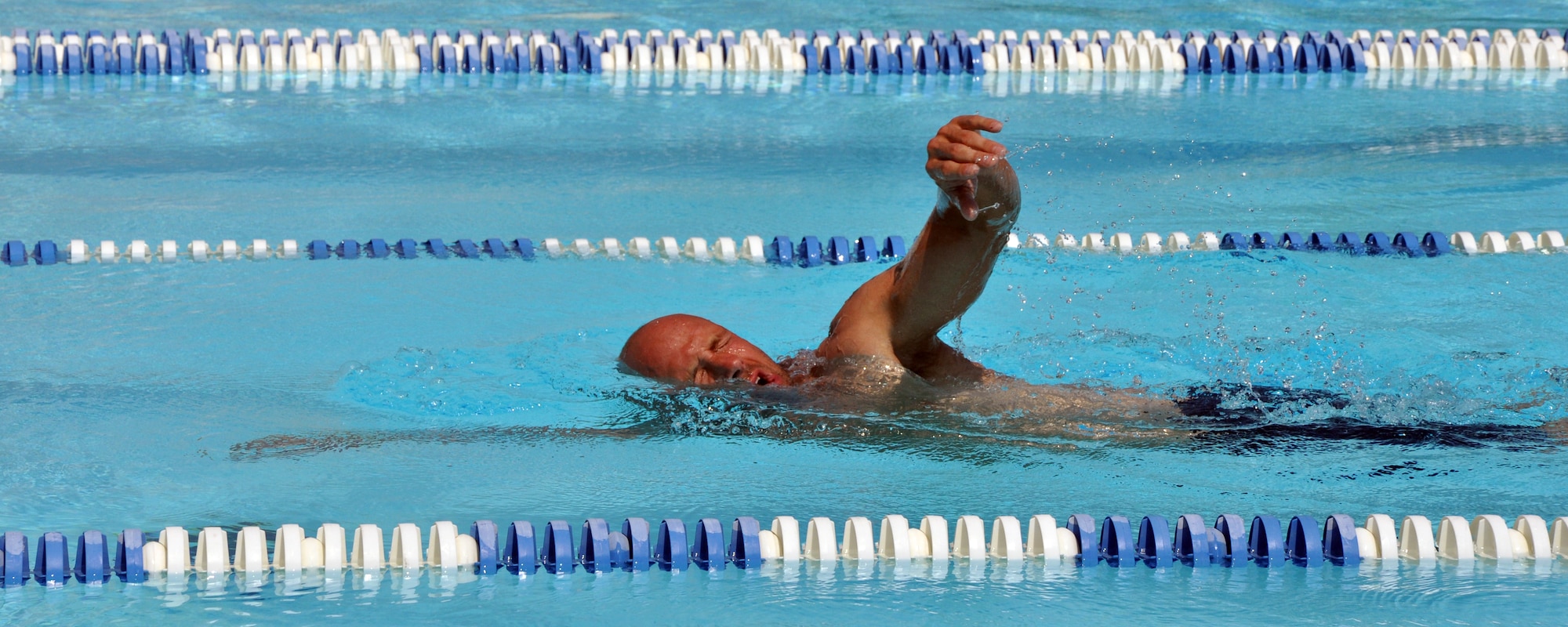 EGLIN AIR FORCE BASE, Fla. – A man swims a forward crawl June 16, practicing a triathlon. The pool is open 6:30 am-6:30 pm, every day except Wednesday to anyone with a military ID for a fee of $2 per person. (U.S. Air Force photo/ Airman Anthony Jennings)