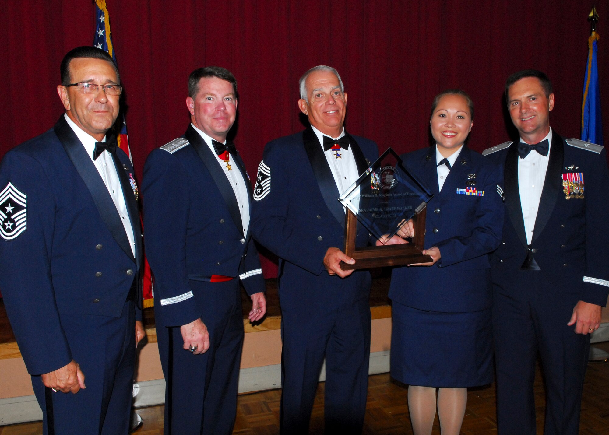Senior Airman Jaime trap-Walker of the 147th Reconnaissance Wing in Houston, receives the Chief Master Sgt William M. Maginot Award for Excellence in the Texas Airman Leadership School graduation ceremony held June 26 in San Antonio.  38 senior airmen from the three Texas wings and geographically separated units attended the two-week Professional Military Education course held.  Air National Guard photo by Senior Master Sgt. Miguel Arellano. 