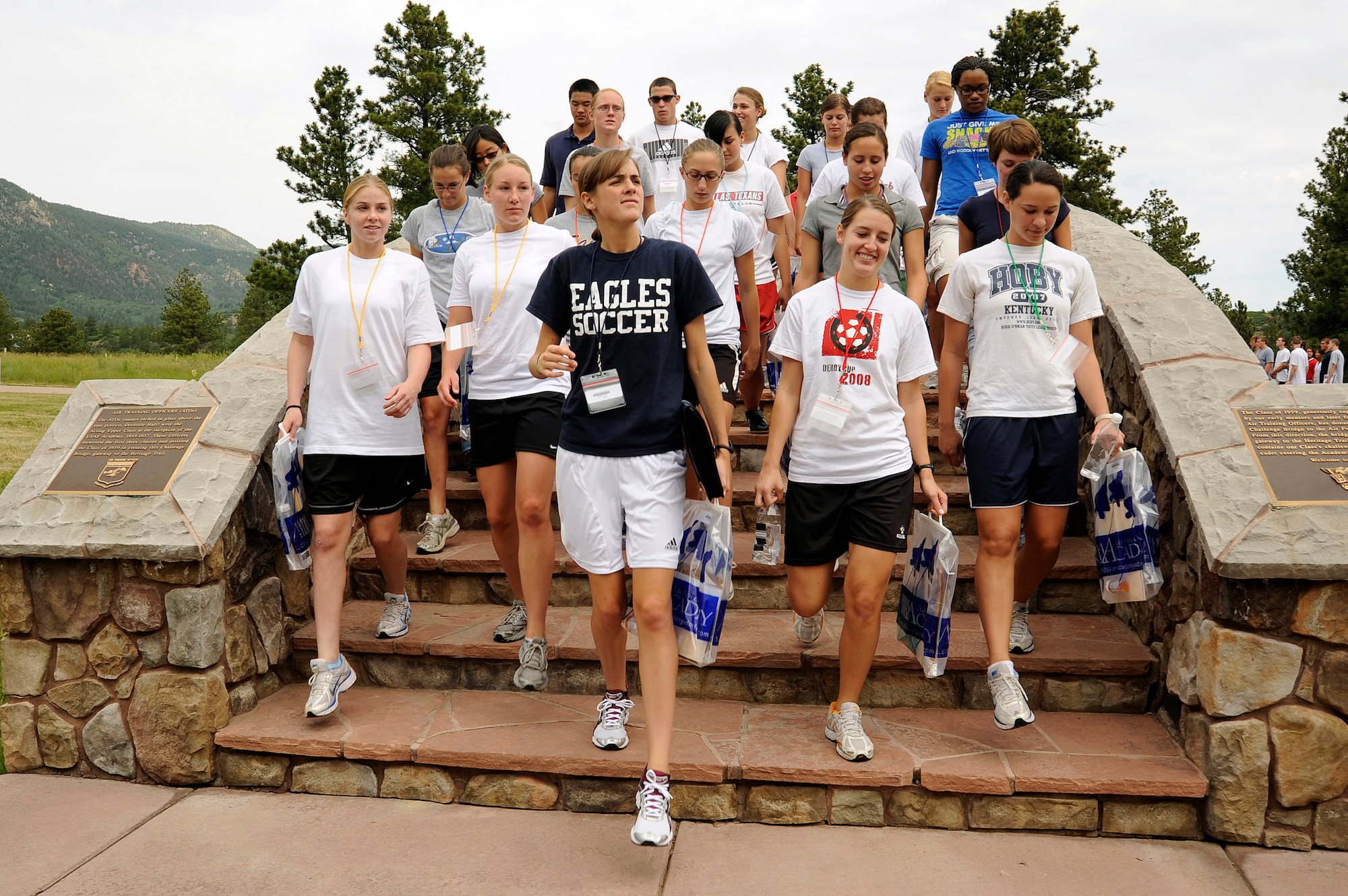 Basic cadets take their first steps into their Air Force careers as they leave Doolittle Hall and cross over the Memorial Bridge at the U.S. Air Force Academy in Colorado Springs, Colo., during cadet inprocessing June 25. (U.S. Air Force photo/Mike Kaplan)