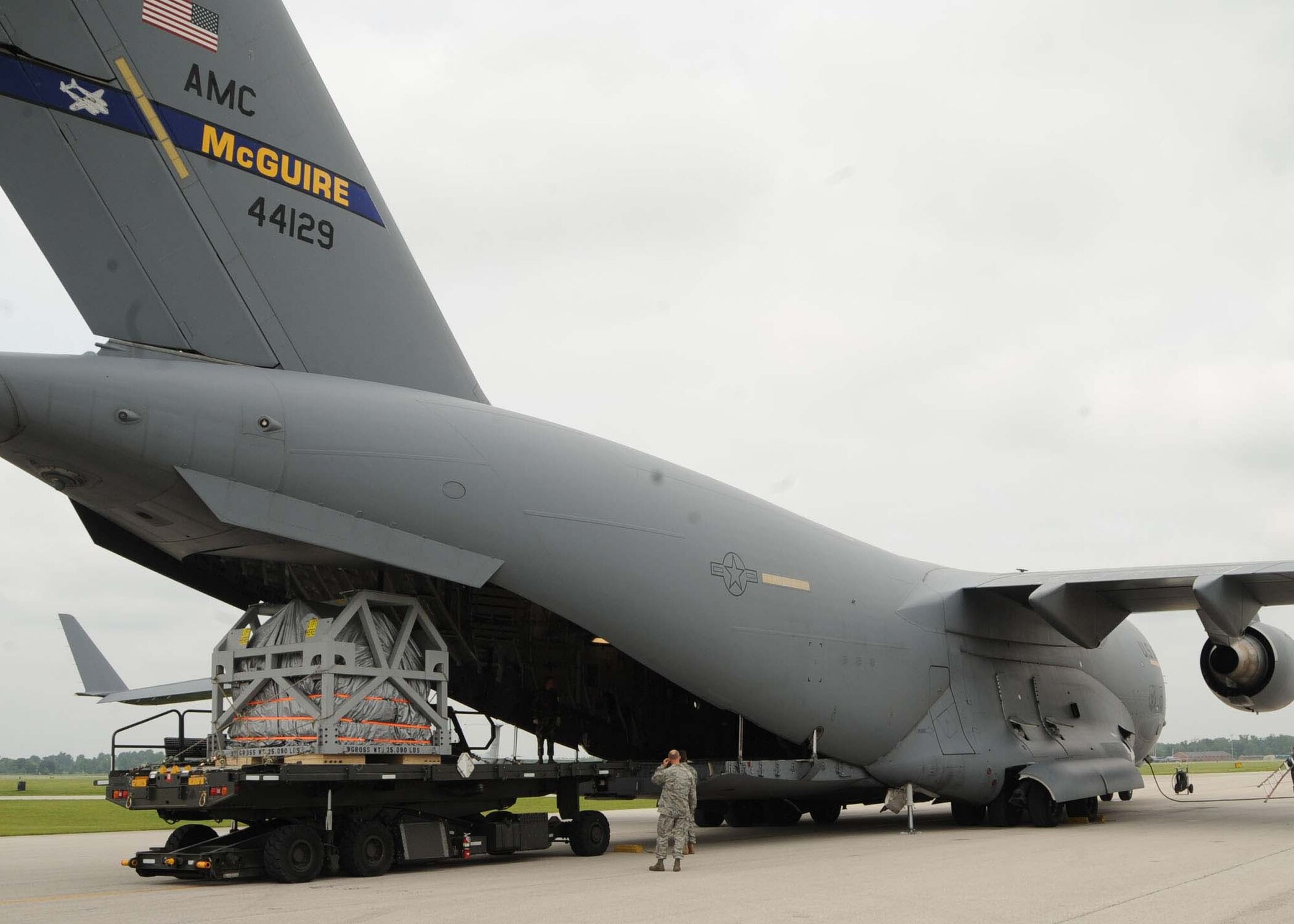 SCOTT AIR FORCE BASE, Ill. -- Airmen at Scott Air Force Base, Ill., load an MRI machine onto a C-17 Globemaster III as Reserve aircrew prepare the aircraft to fly a humanitarian mission. The MRI machine, which was donated by Washington University in Saint Louis, Mo., was recently flown to Salta, Argentina, by members of 732nd Airlift Squadron assigned to Joint Base McGuire-Dix-Lakehurst. (U.S. Air Force photo/Airman 1st Class Wesley Farnsworth)