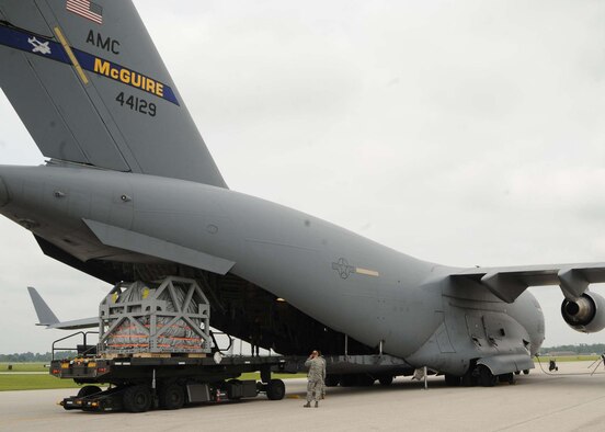 SCOTT AIR FORCE BASE, Ill. -- Airmen at Scott Air Force Base, Ill., load an MRI machine onto a C-17 Globemaster III as Reserve aircrew prepare the aircraft to fly a humanitarian mission. The MRI machine, which was donated by Washington University in Saint Louis, Mo., was recently flown to Salta, Argentina, by members of 732nd Airlift Squadron assigned to Joint Base McGuire-Dix-Lakehurst. (U.S. Air Force photo/Airman 1st Class Wesley Farnsworth)