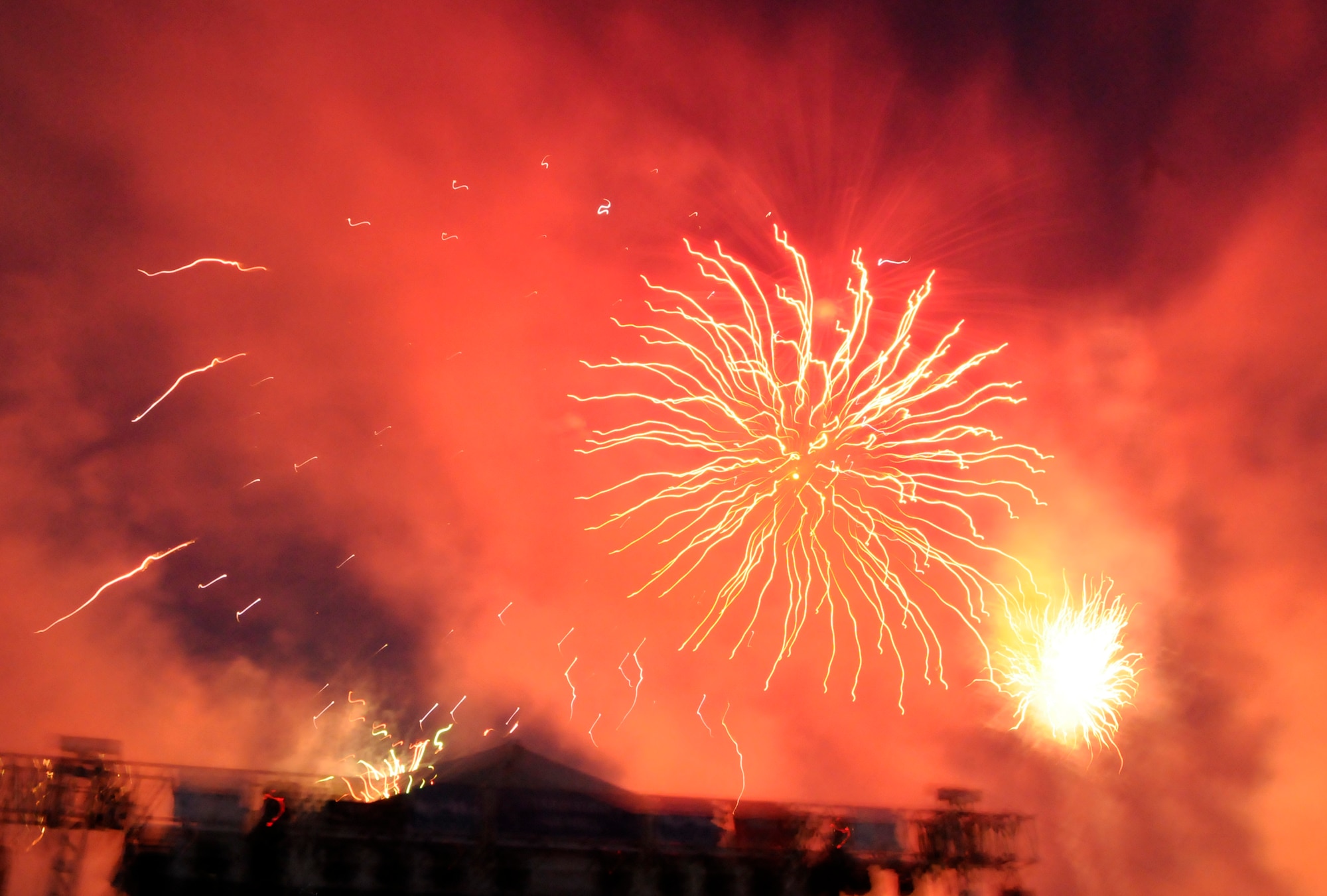 Smoky explosions fill the night as part of an Independence Day celebration at RAF Feltwell.  Fireworks displays are customary during this holiday to remember the "bombs bursting in air" during the Revolutionary war.  (U.S. Air Force photo by Staff Sgt. Christopher L. Ingersoll)