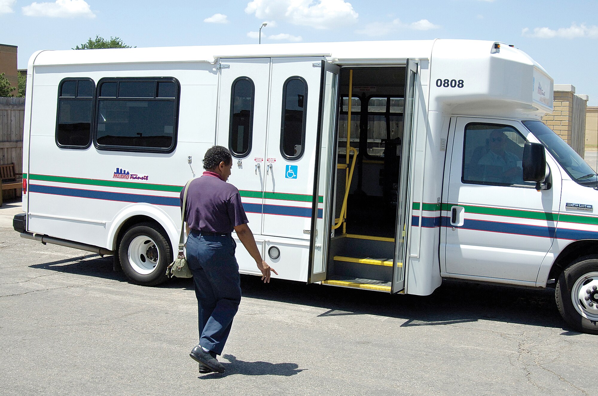 Merwyn Dinwiddie ends her day at the Vanwey Dining Facility, boarding a METRO Transit’s METRO Lift vehicle to take her home. The Dale Rodgers Training Center employee is one of the first at Tinker to use the public transportation service that provides door to door rides to persons with disabilities. When caregivers can’t bring someone to work, the lift service steps in. It is a benefit to everyone base. “It allows the employees a sense of independence,” says Barry Henderson, the Dale Rogers Training Center contract manager. (Photo by Margo Wright)