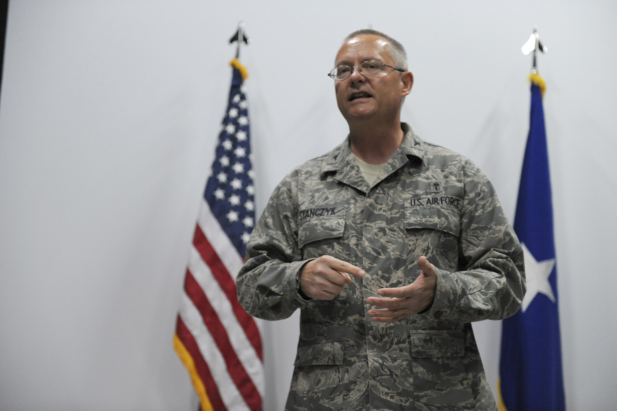 SOUTHWEST ASIA - Col. David Stanczyk, 380th Expeditionary Medical Group, commander, makes his first speech to Airmen of the 380th EMDG and 380th Air Expeditionary Wing after accepting command during a ceremony, July 2 at an undisclosed location in Southwest Asia. Colonel Stanczyk comes from Little Rock AFB, Ark. joining the 380th Air Expeditionary Wing to lead the 380th EMDG. (U.S. Air Force photo by Senior Airman Brian J. Ellis)