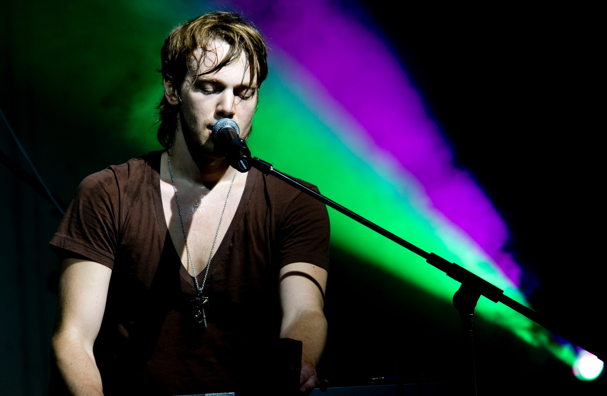 Joel Larabell, lead vocalist and keyboardist for the band Brenn, performs with the rest of the band in front of a crowd of several hundred during Freedom Fest Saturday, July 4, 2009 at Arkadas Park, Incirlik Air Base, Turkey. The Nashville, Tenn., rock band was just one part of the festivities during the Fourth of July celebration. There were also games, donkey rides, a petting zoo, food booths and jump houses. There was a firework show to end the night with a bang. (U.S. Air Force photo/Staff Sgt. Raymond Hoy)