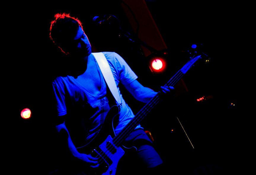 Jeff Shooty, bass player and backing vocalist for the band Brenn, performs with the rest of the band in front of a crowd of several hundred during Freedom Fest Saturday, July 4, 2009 at Arkadas Park, Incirlik Air Base, Turkey. The Nashville, Tenn., rock band was just one part of the festivities during the Fourth of July celebration. There were also games, donkey rides, a petting zoo, food booths and jump houses. There was a firework show to end the night with a bang. (U.S. Air Force photo/Staff Sgt. Raymond Hoy)
