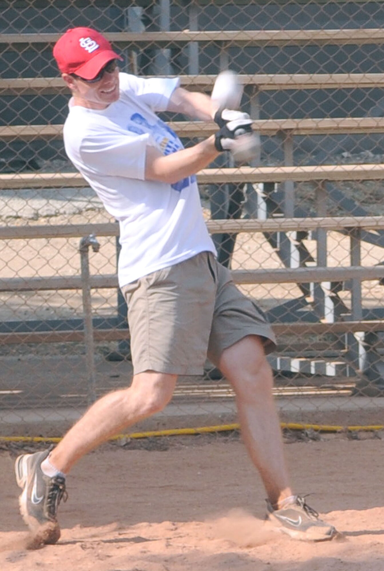 Seth Jenny, the Health and Wellness Center fitness program manager, swings for the fence during the Freedom Fest Home Run Derby Saturday, July 4, 2009 at Incirlik Air Base, Turkey. The winner of the competition was 1st Lt. Jeremy McNatt, 39th Maintenance Squadron, who was awarded an AAFES gift certificate. Freedom Fest was the base’s official Fourth of July celebration and included events such as live bands, concession stands, arts and crafts, a petting zoo and a fireworks show. (U.S. Air Force photo/Senior Airman Alex Martinez)