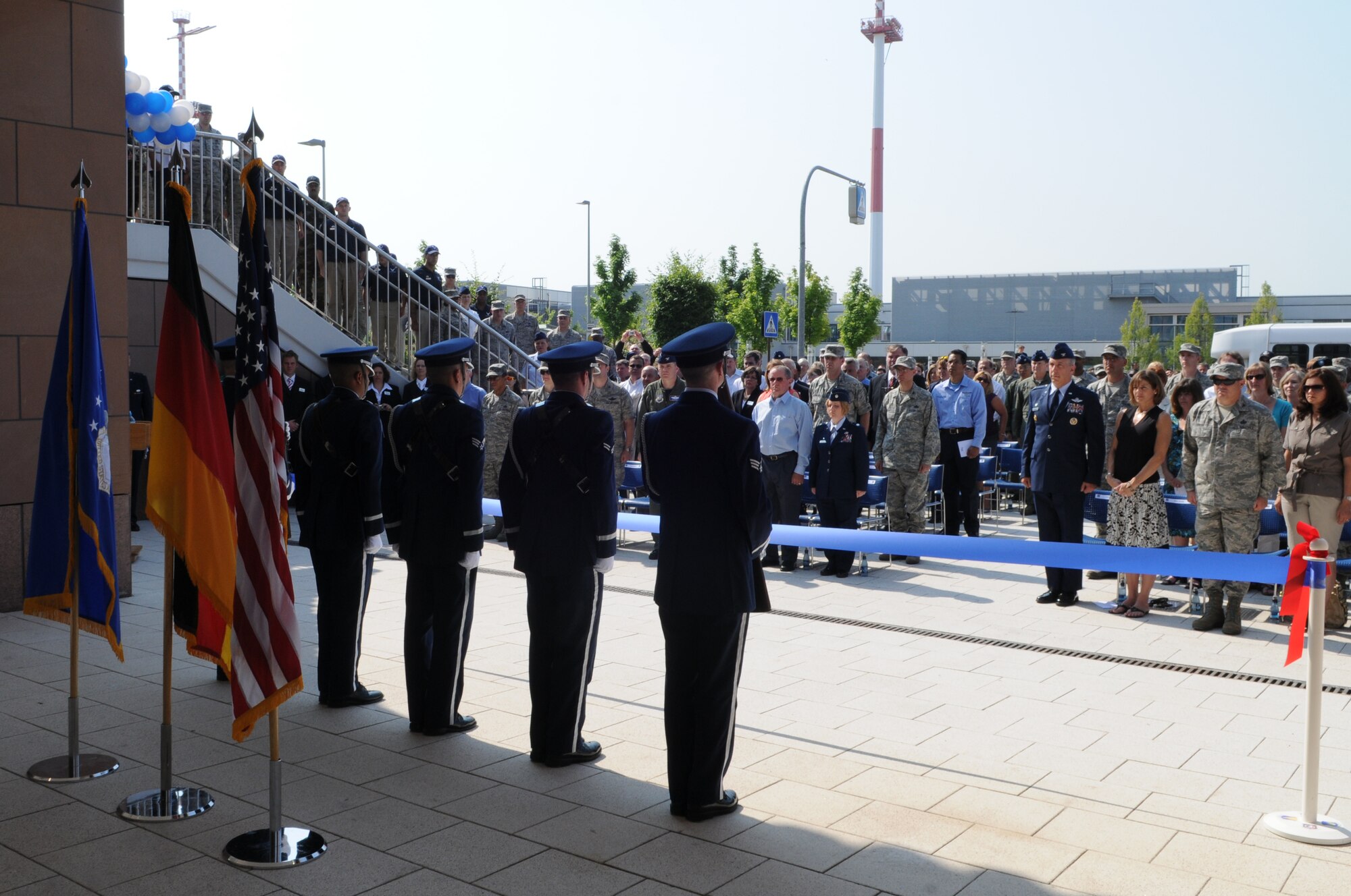 The Honor Guard posts the Flags at the Kaiserslautern Military Community Center ribbon cutting ceremony, Ramstein Air Base, Germany, July 2, 2009.  Ramstein Inn’s Visitor's Quarters, Outdoor Recreation, Romano’s Macaroni Grill, a shoppette, Ramstein Tickets and Tours, the Sports Lounge and a German bakery are part of the first phase of openings at the KMCC. (U.S. Air Force Airman 1st Class Caleb Pierce)