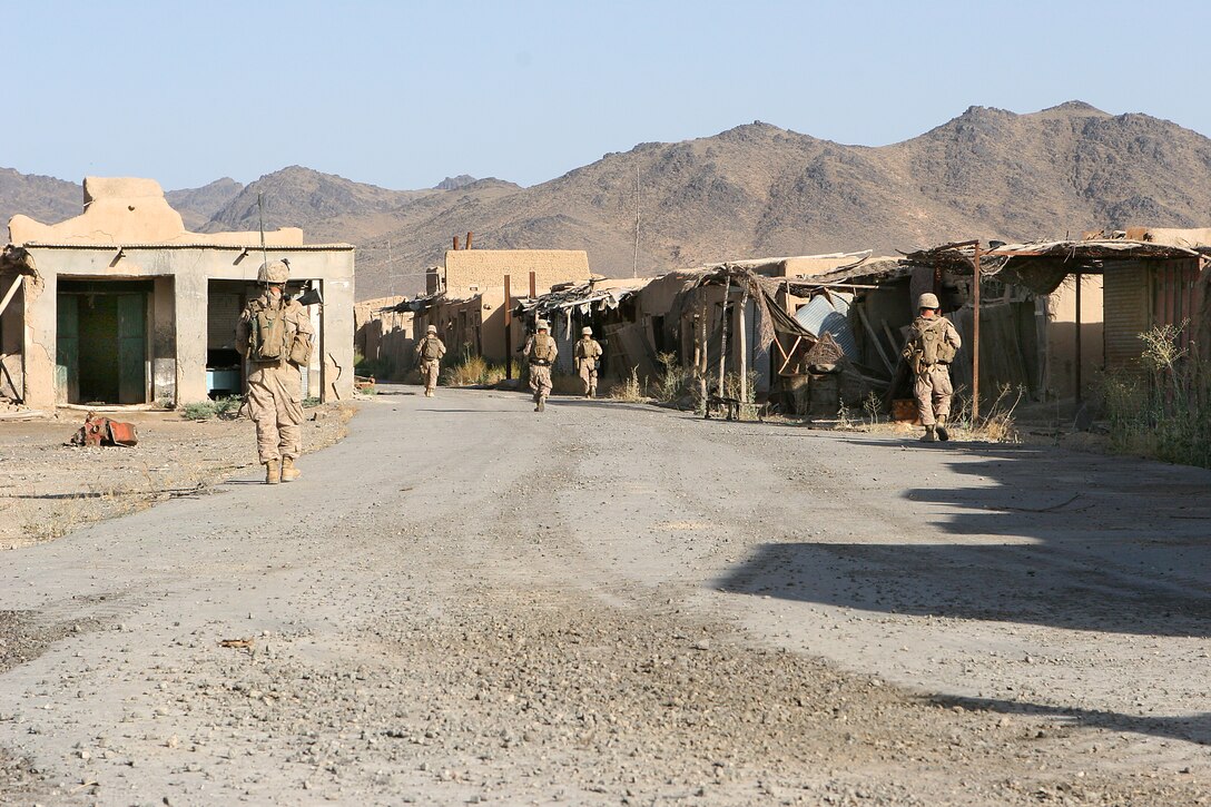 U.S. Marines conduct a patrol during early morning operations through the mine-infested town of Now Zad in Afghanistan'ts Helmand province, June 27, 2009.