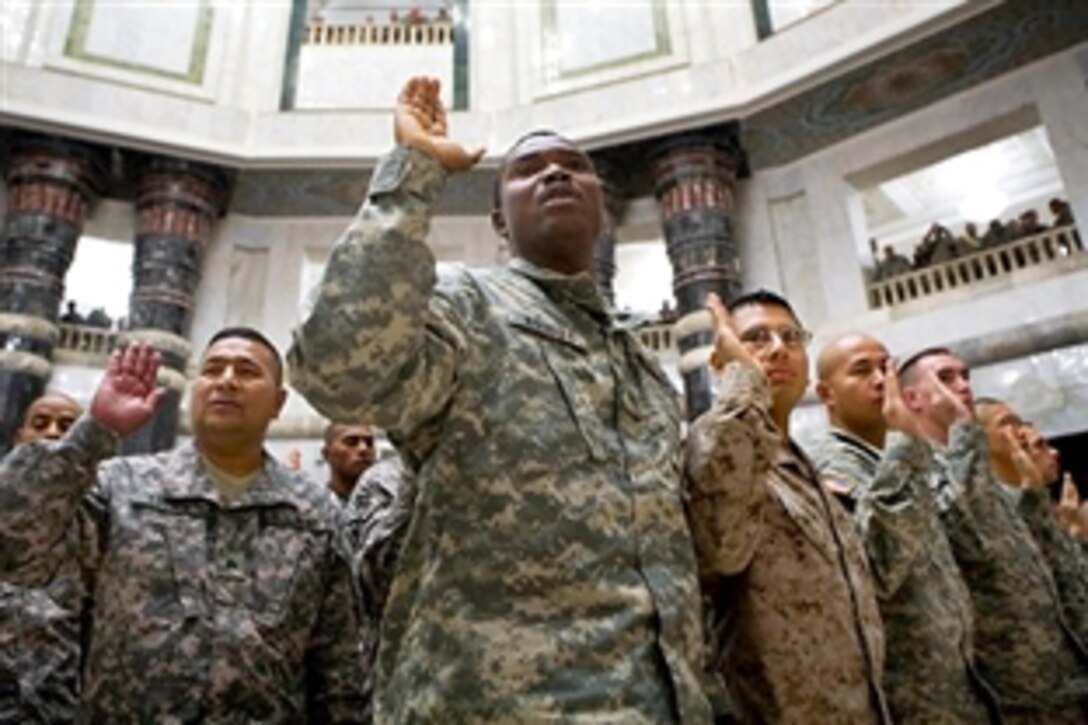 U.S. troops take the citizenship oath inside Al-Faw palace on Camp Victory, Iraq, July 4, 2009. Vice President Joe Biden and Army Gen. Raymond T. Odierno, commander of Multinational Force Iraq, presided over the naturalization ceremony.