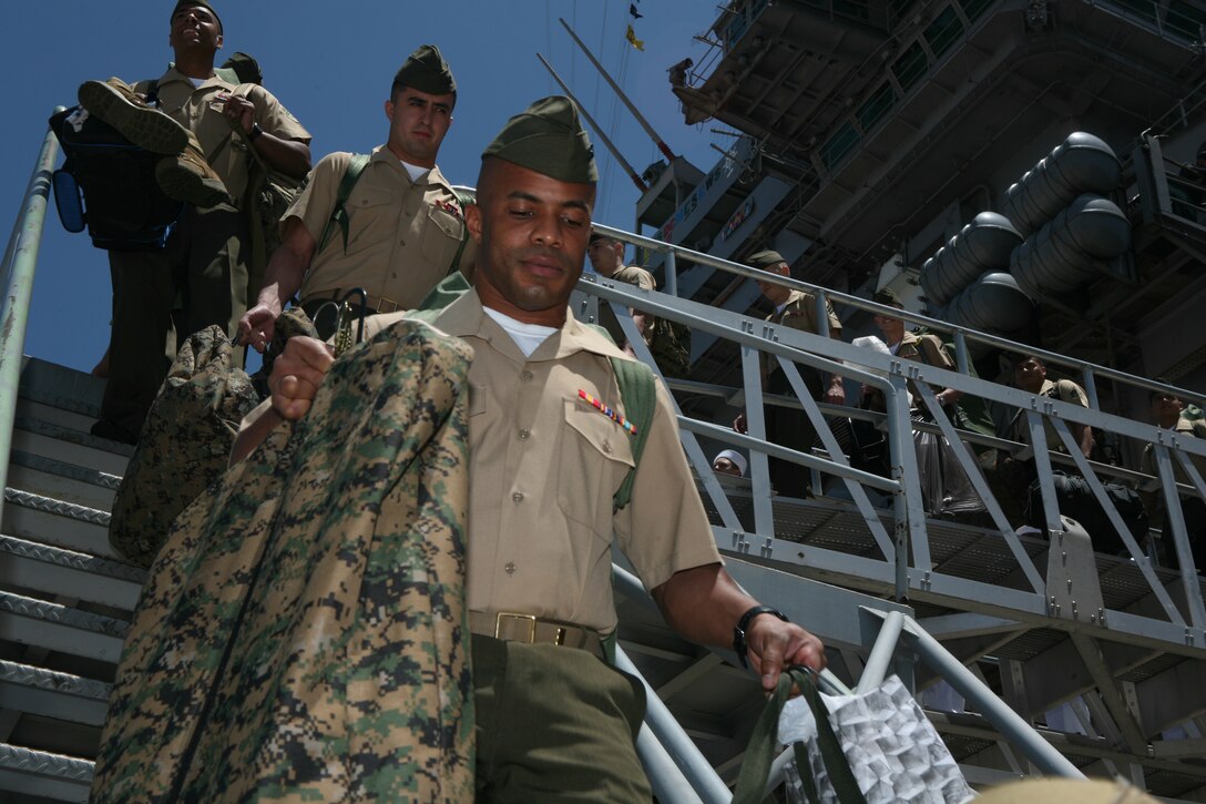 The "Death Rattlers" step off the USS John C. Stennis after a six-month Marine Forces Pacific deployment, June 6. The squadron help with missions and humanitarian efforts during the deployment.