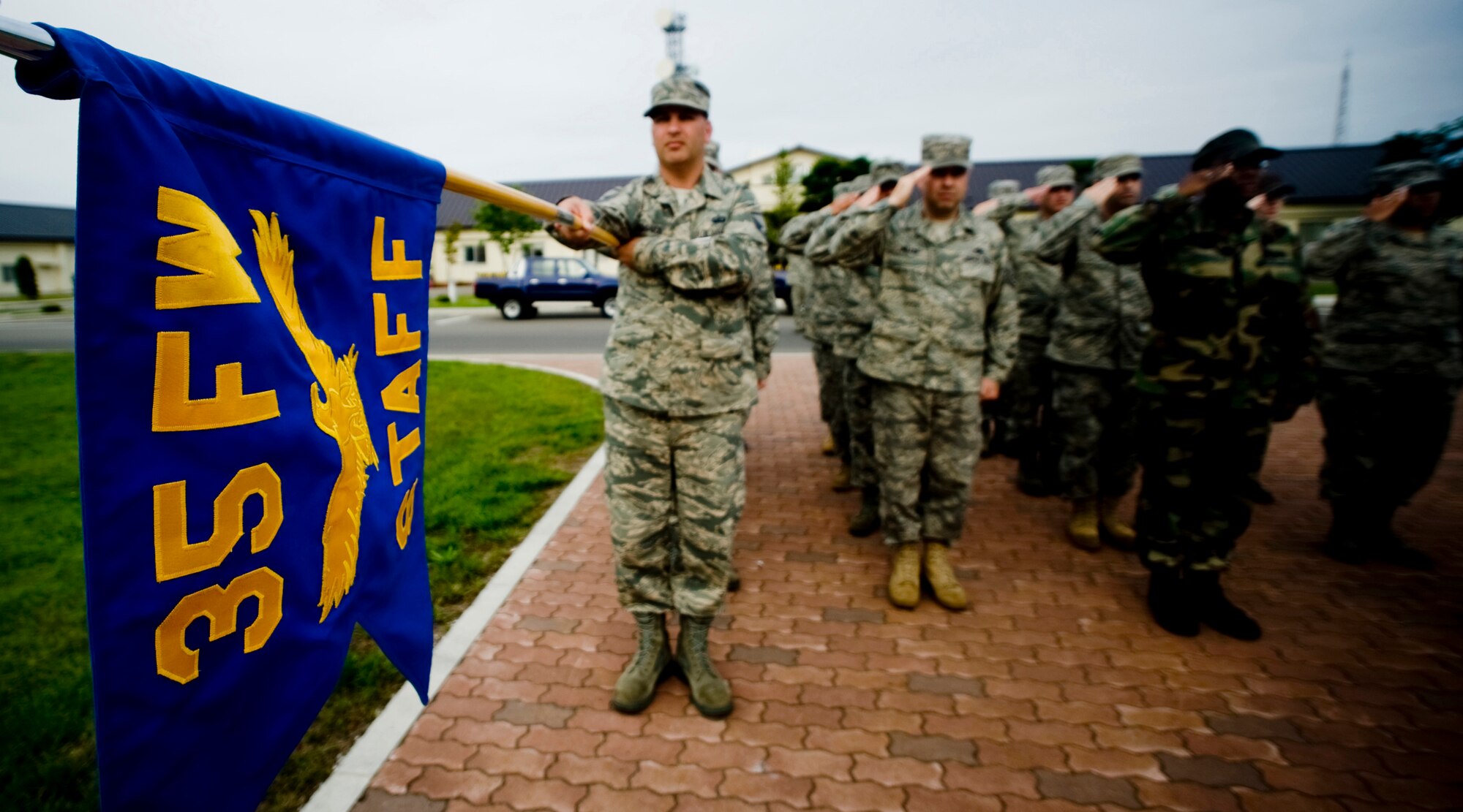 MISAWA AIR BASE, Japan -- Members of the 35th Fighter Wing staff agencies salute during a retreat ceremony July 2 at the base flag pole. Participants in the ceremony were asked to reflect on the heritage and traditions of the United States and Japan and were reminded to stay safe during the extended weekend. (U.S. Air Force photo/Senior Airman Jamal D. Sutter)