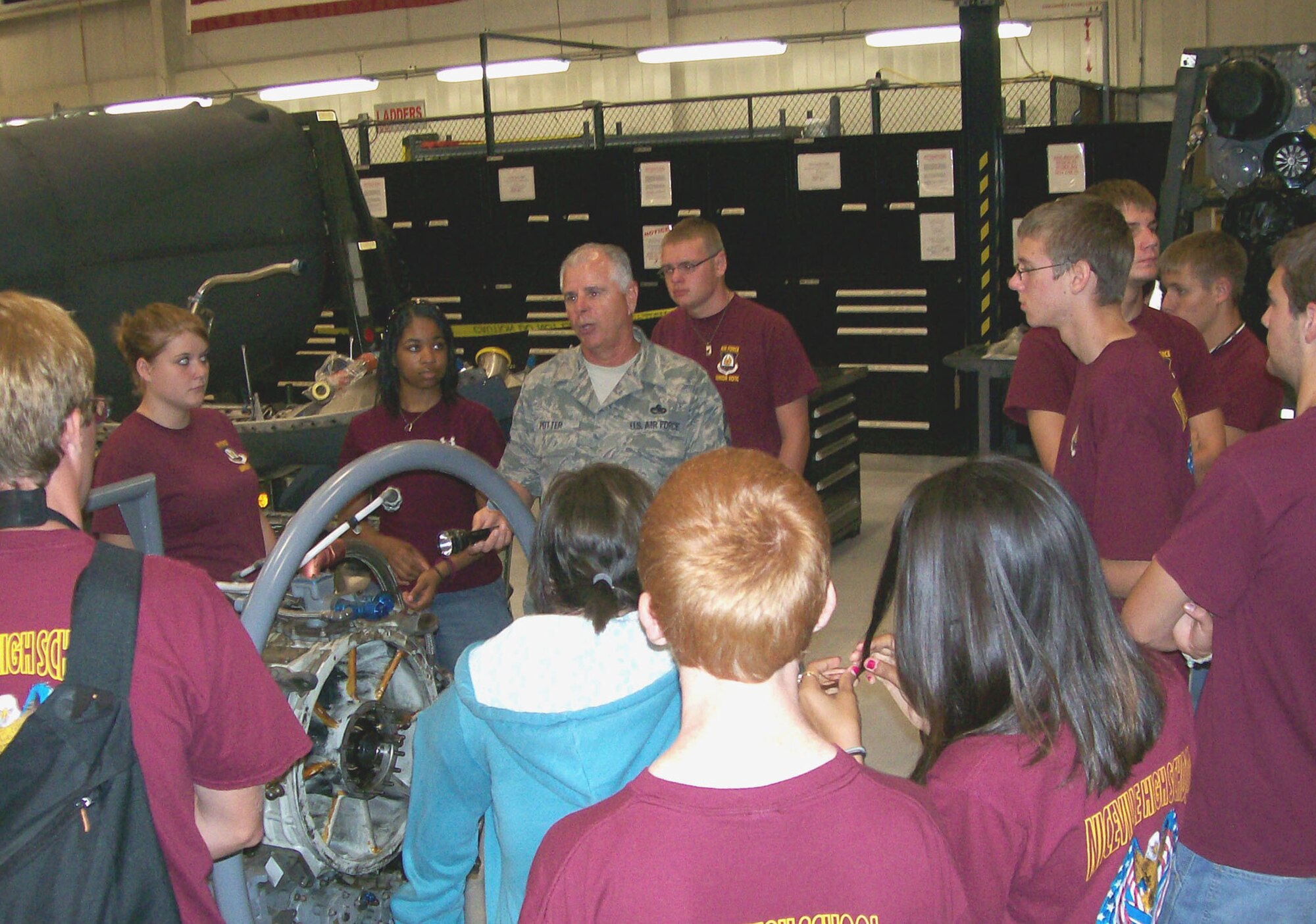 Air Force Reserve Chief Master Sgt. Kenneth Potter, 919th Maintenance Squadron propulsion flight chief, briefs cadets from Niceville High School’s Junior ROTC program about MC-130E aircraft engine maintenance June 30 as part of the 919th Special Operations Wing’s Junior ROTC Day. Four other high school Junior ROTC programs also visited, getting tours of the life support shop, maintenance, and even a short flight on an MC-130E.  Approximately 110 students toured the base. (U.S. Air Force photo/Dan Neely)
