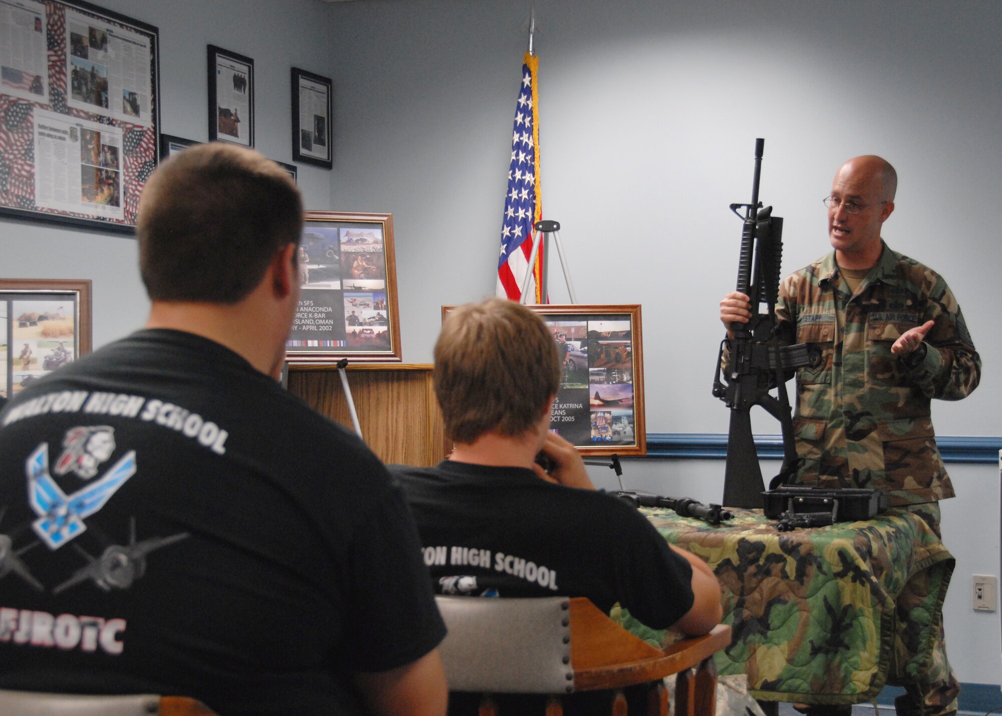 Air Force Reserve Master Sgt. Joe Stapp, 919th Security Forces Squadron, briefs Walton High School Junior ROTC cadets on weaponry and equipment June 30 as part of the 919th Special Operations Wing’s Junior ROTC Day at Duke Field.  Four other high school Junior ROTC programs also visited, getting tours of the life support shop, maintenance and even a short flight on an MC-130E aircraft.  Approximately 110 cadets and their leaders toured the base.  (U.S. Air Force photo/ Staff Sgt. Samuel King Jr.)