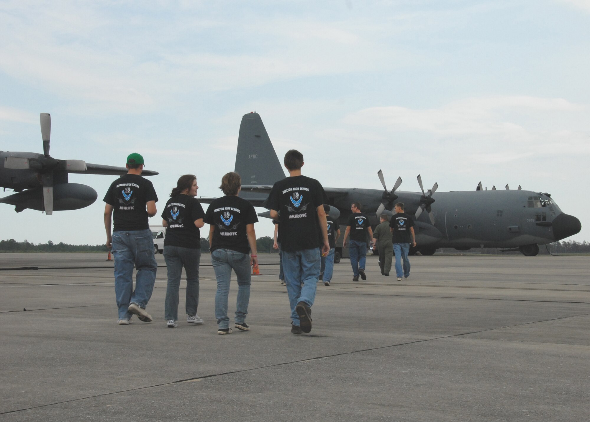 Members of the Junior ROTC program from Walton High School step to a 919th Special Operations Wing MC-130E aircraft for an incentive flight June 30 as part of Junior ROTC Day at Duke Field.  Four other high school Junior ROTC programs also visited, getting tours of the life support shop, maintenance and even a short flight on an MC-130E.  Approximately 110 students toured the base.  (U.S. Air Force photo/ Staff Sgt. Samuel King Jr.)