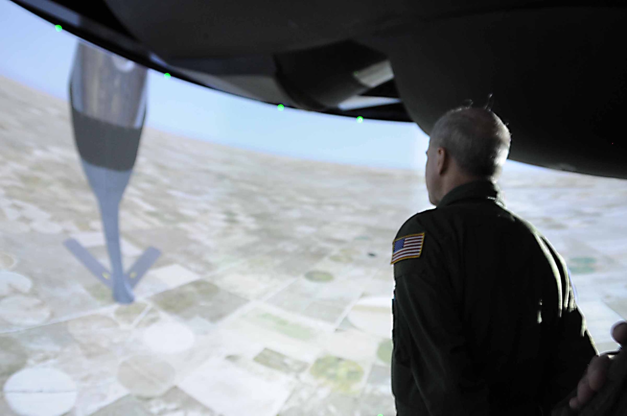 ALTUS AIR FORCE BASE, Okla. -- Brig. Gen. Richard T. Devereaux tours the new boom operator weapons training system at the KC-135 aircrew training center June 5. Students will begin training in the simulators fall 2009. (U.S. Air Force photo by Senior Airman Leandra D. Hernandez)