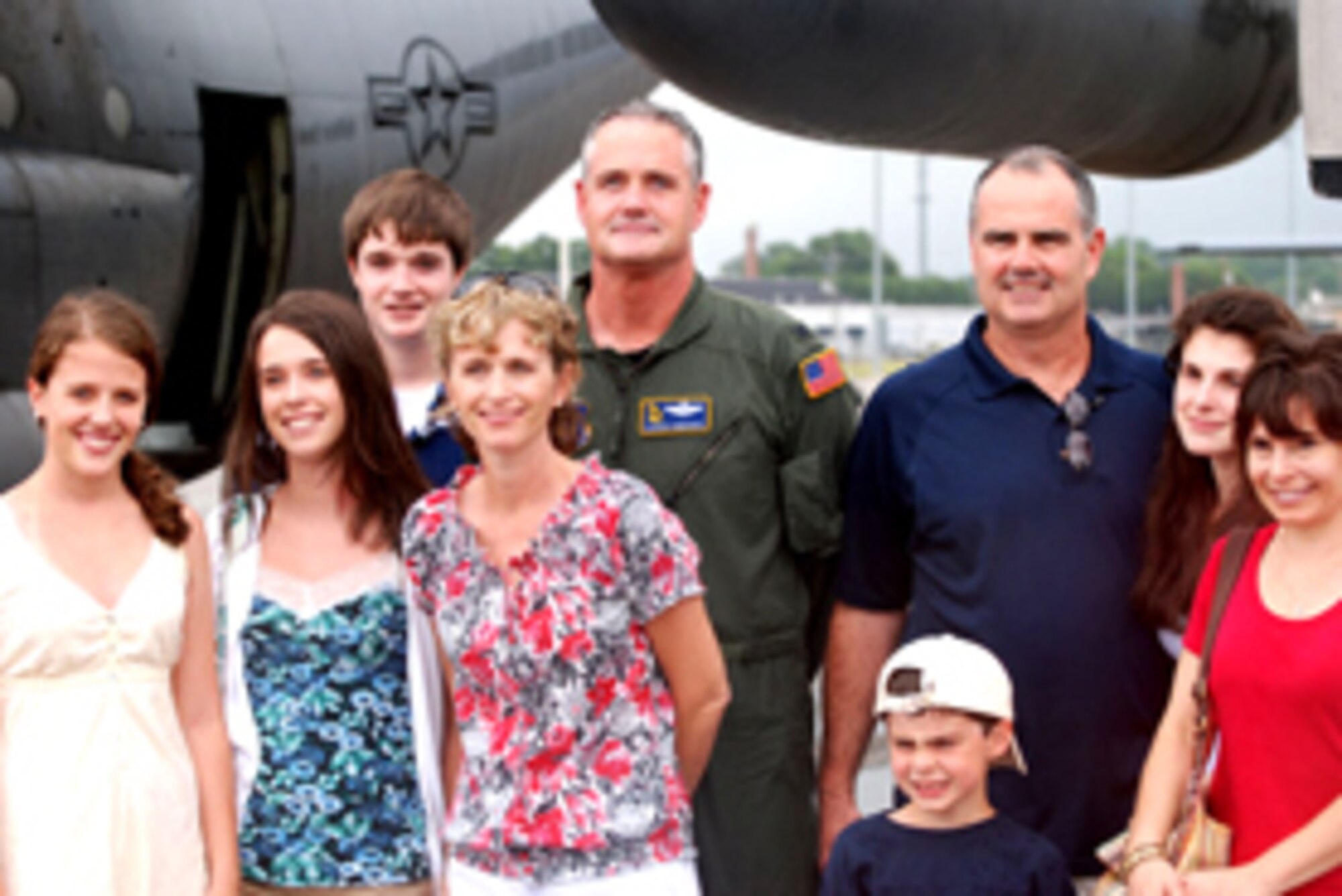 Col. Darrin Simmonds, former 94th Operations Support Squadron commander, poses with his family members after the colonel's final flight while assigned to the 94th Operations Group July 6. Colonel Simmonds will take a new position at 22nd Air Force here at Dobbins Air Reserve Base. (U.S. Air Force photo/Tech. Sgt. Bob Martin)