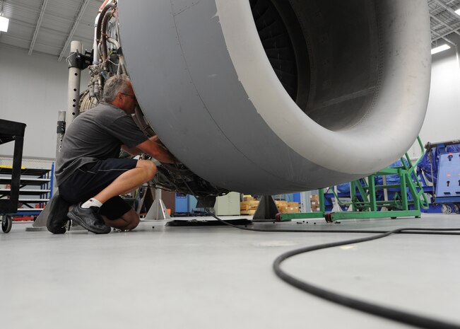 Corey Seeber works on a C-17 engine here June 22. Mr. Seeber is an aviation maintenance technician with United Airlines. (U.S. Air Force photo/Senior Airman Katie Gieratz)(Released)