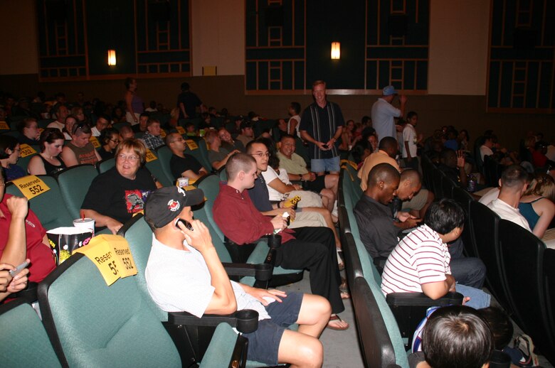 Col. Scott Forest, vice commander, 552 ACW, talks with some members of the wing before the movie started at the free screening of "Transformers: Revenge of the Fallen" June 27 at the base theater.