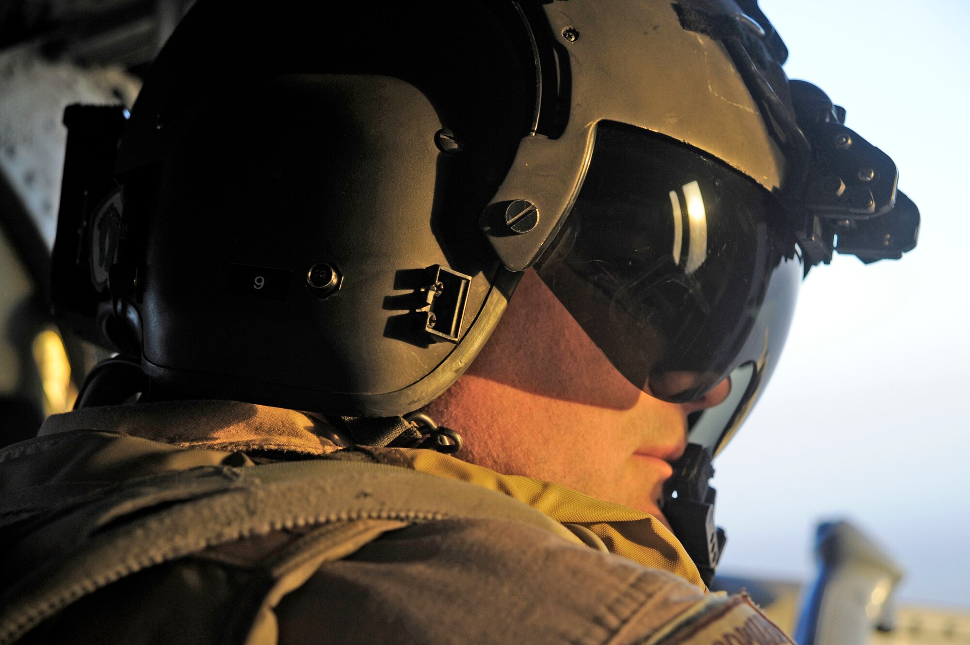 Tech. Sgt. Brock Woodward provides security during combat operations June 23 above the Hemland Province, Afghanistan. Sergeant Woodward is a flight engineer with the 129th Expeditionary Rescue Squadron. (U.S. Air Force photo/Staff Sgt. Shawn Weismiller) 